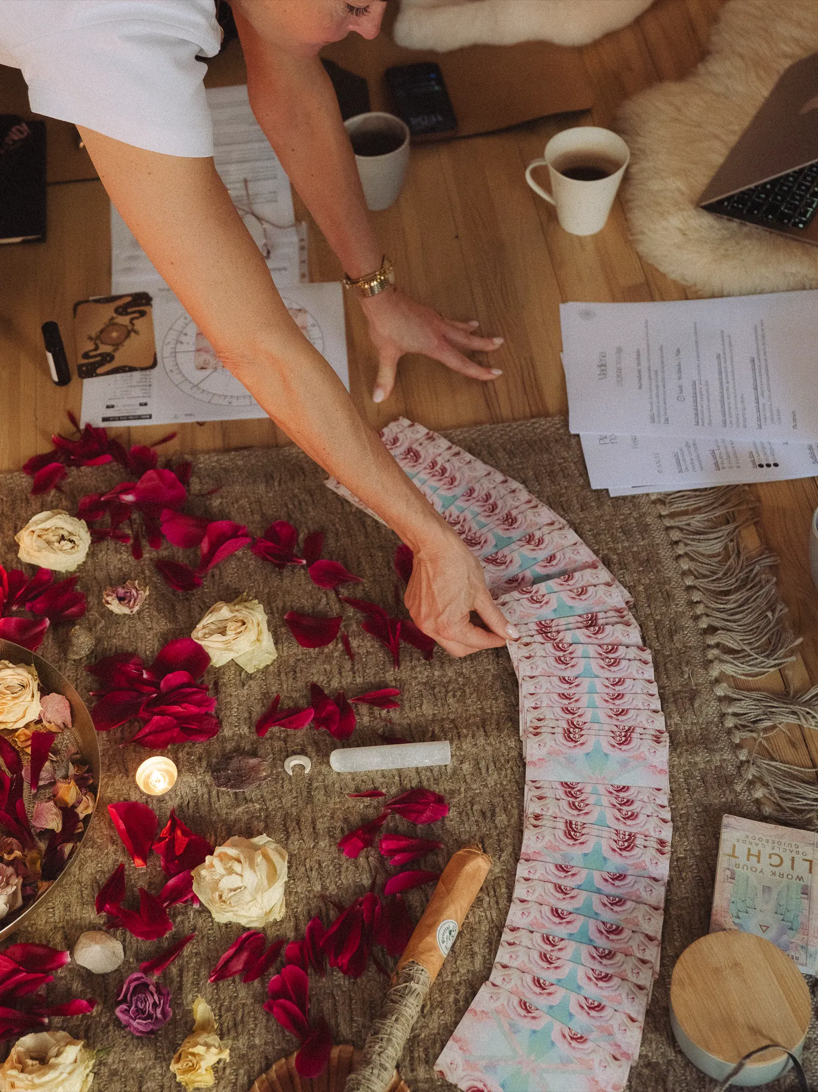 Flowers, cards, candles, and ritual setup.